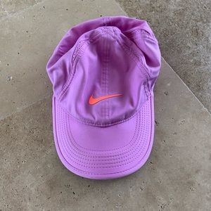 Nike cap on lilac with a neon pink Nike check